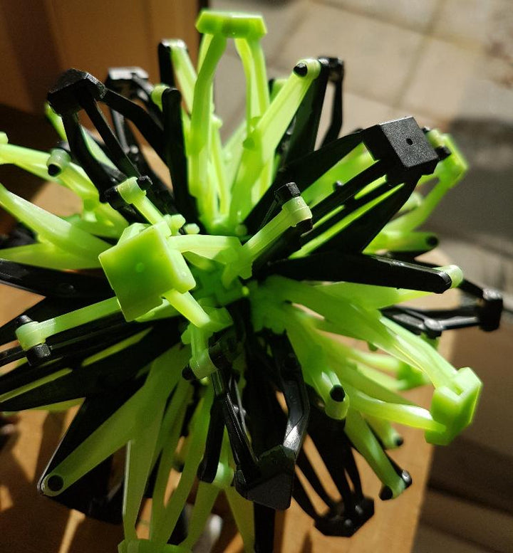 Toys42Hands Hoberman sphere firefly glow mini