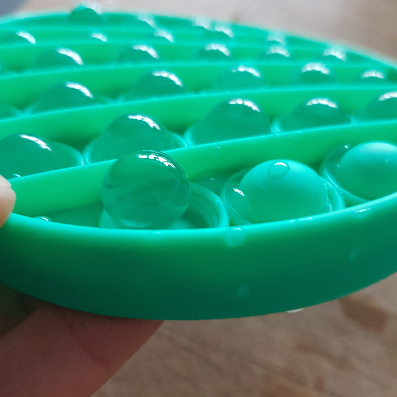 Toys42Hands Pop it rond gevuld met transparente waterbeads, sensoriek en motoriek speelmateriaal